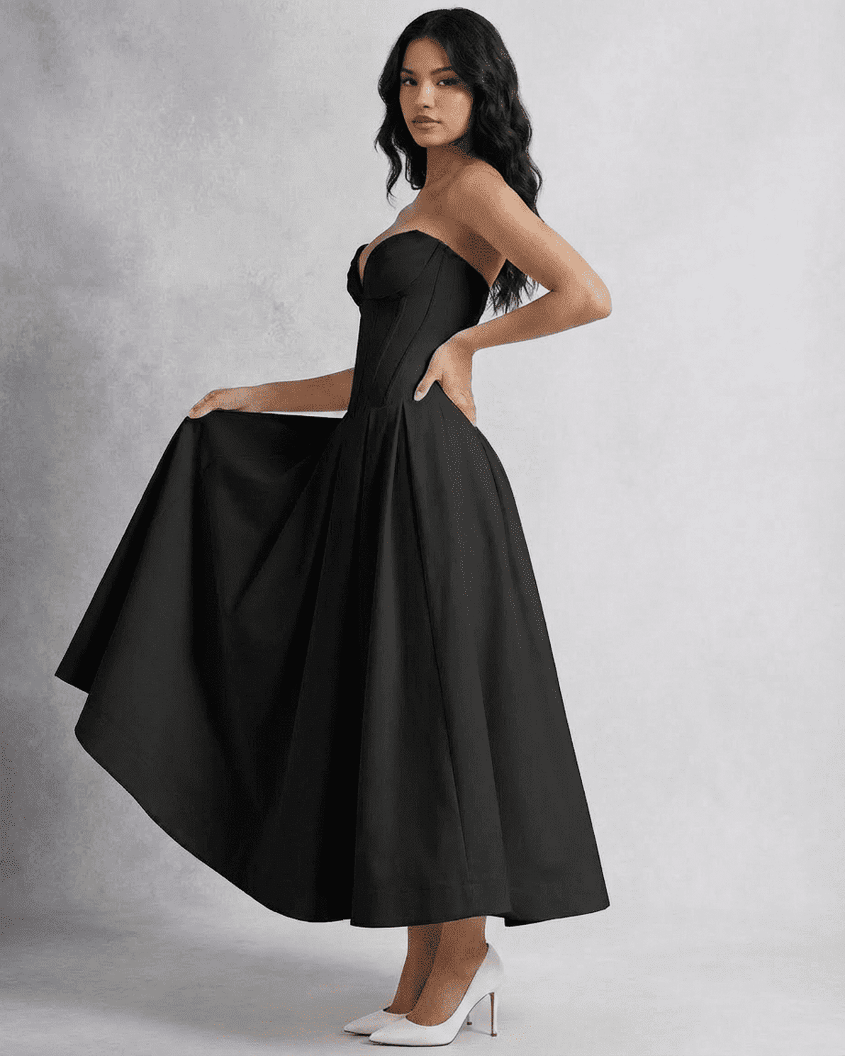 Elegant model showcasing the Slimona Nova Midi Dress, a sleek strapless A-line design perfect for formal events.