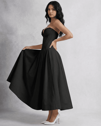 Elegant model showcasing the Slimona Nova Midi Dress, a sleek strapless A-line design perfect for formal events.