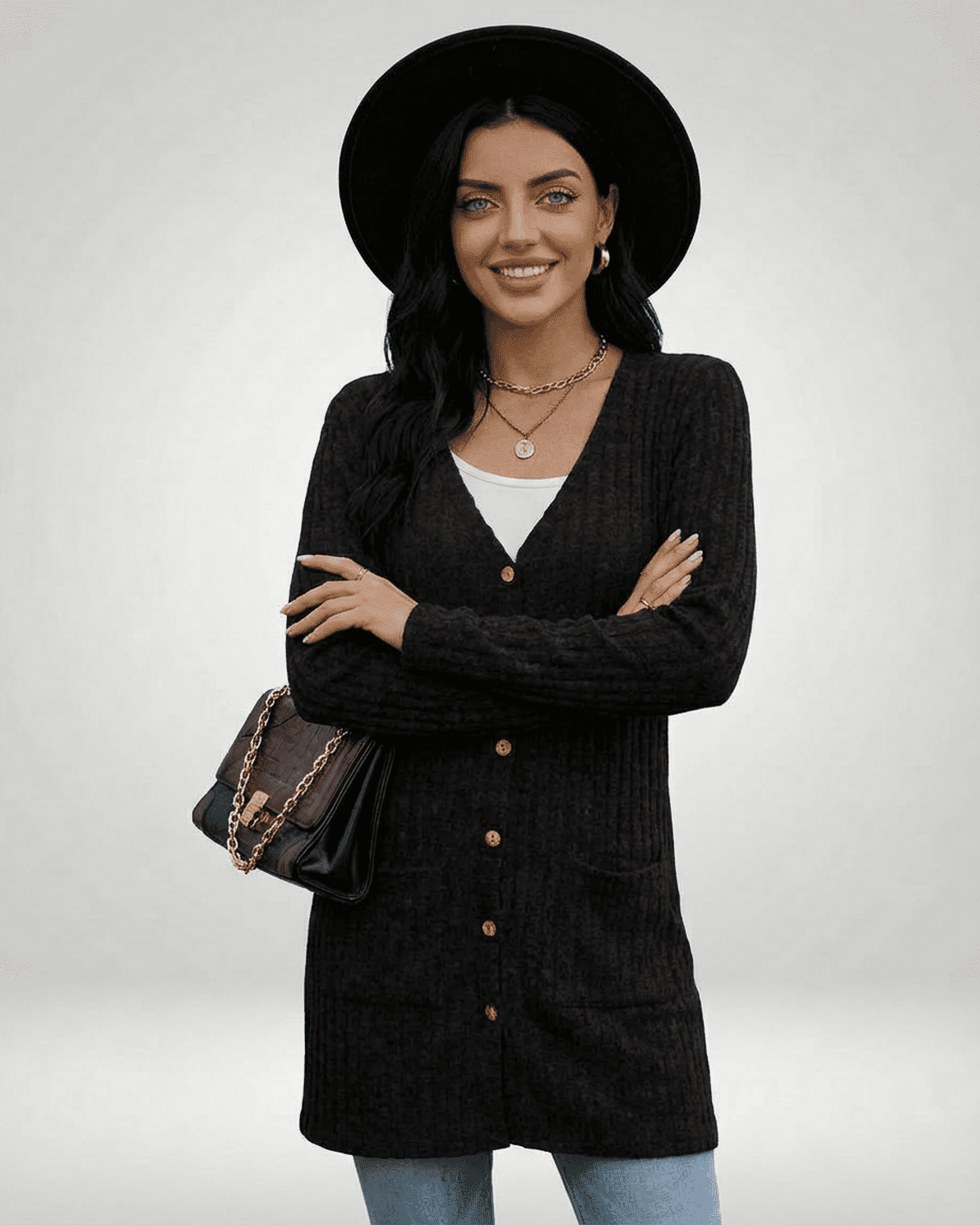 Model wearing Slimona Nyx Cardigan in black, featuring a longline silhouette and button-front design.