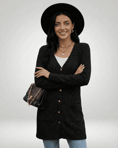Model wearing Slimona Nyx Cardigan in black, featuring a longline silhouette and button-front design.