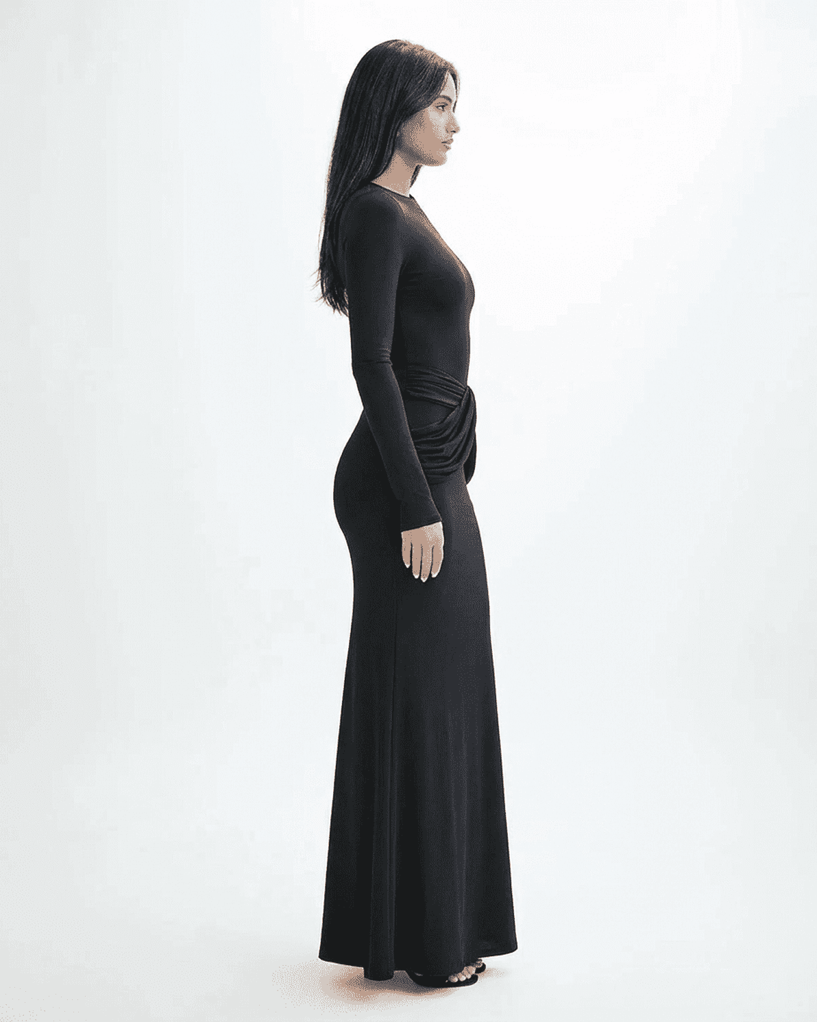 Orion Maxi Dress by Slimona featuring a long sleeve crew neck silhouette with ruched detail and a sleek black finish.