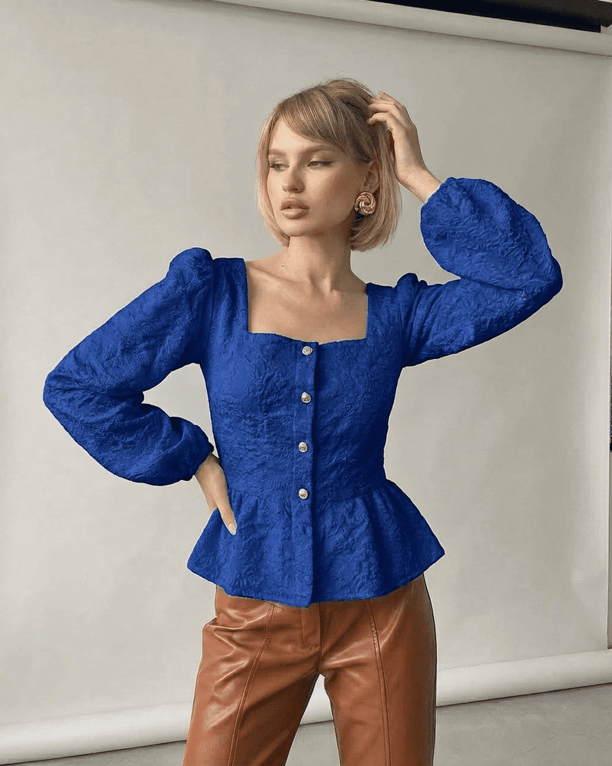 Sapphire Corset Top by Slimona featuring a jacquard square neck and puff sleeves in deep blue.