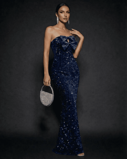 Slimona Sapphire Maxi Dress featuring strapless design and stunning bow, perfect for elegant party occasions.