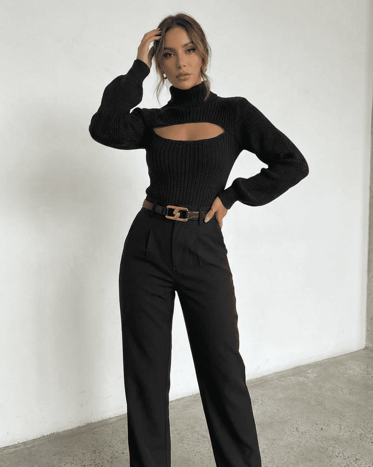 Sarina Sweater by Slimona - Chic black mock neck sweater with hollow out design styled with high-waisted pants.