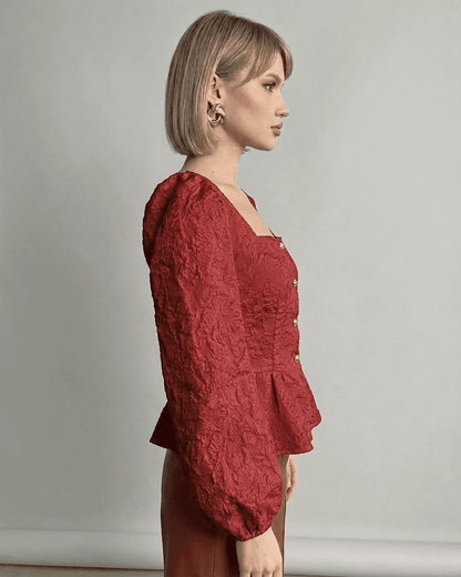 Scarlet Corset Top by Slimona featuring jacquard texture and structured puff sleeves in a deep red hue.