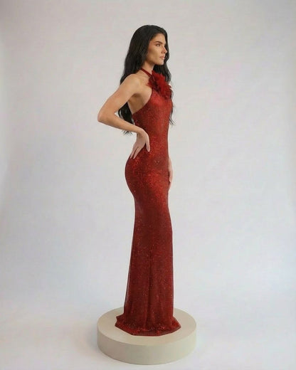 Scarlet Maxi Dress by Slimona, showcasing a sleek halter neck and elegant floral detail in a rich red tone.