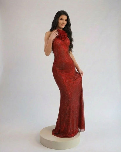 Scarlet Maxi Dress by Slimona in a stunning red hue with halter neck and floral detail, showcasing a floor-length silhouette.