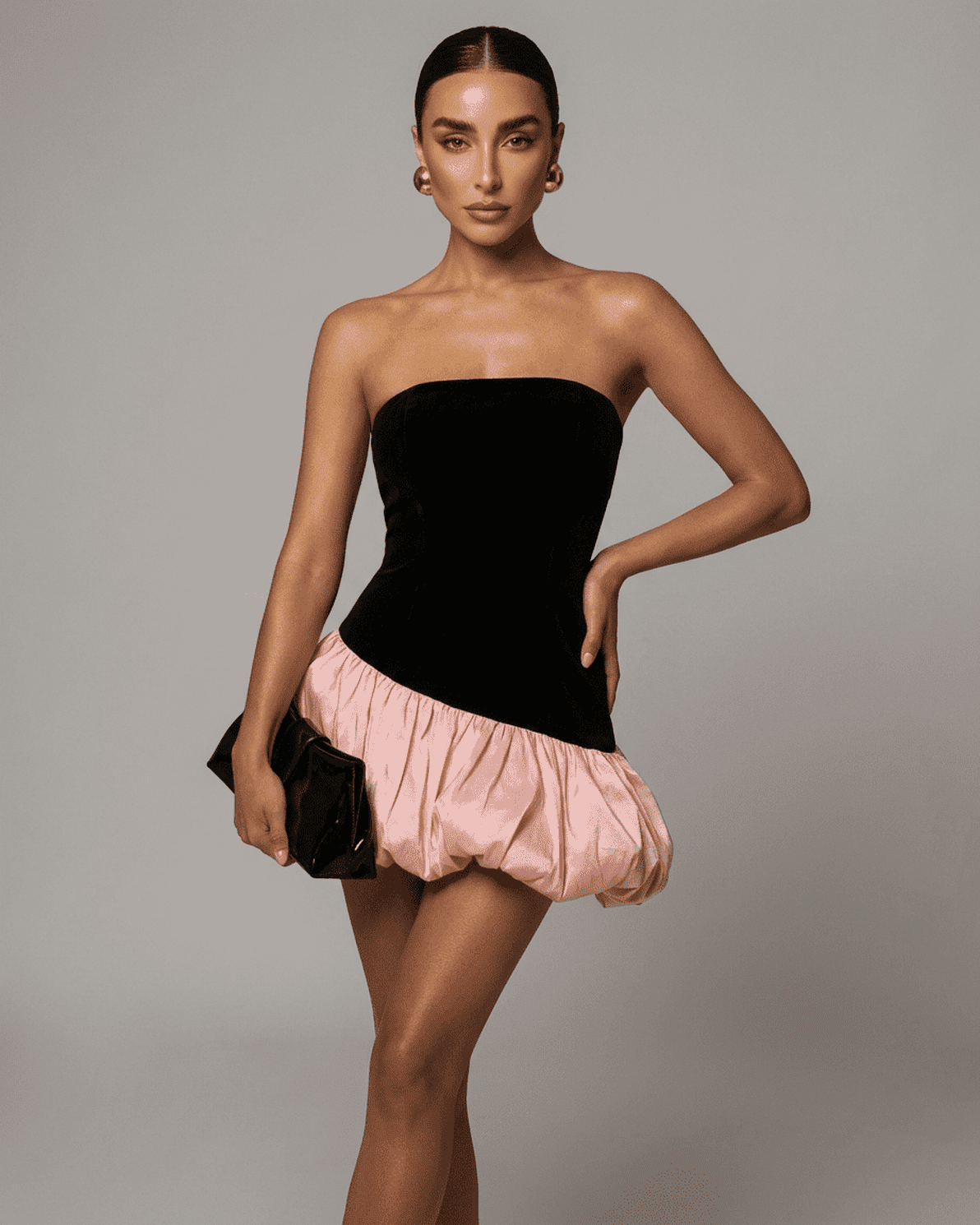 Selina Mini Dress by Slimona featuring strapless black velvet and pink puffed skirt, perfect for a stylish night out.