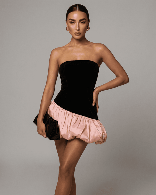 Selina Mini Dress by Slimona featuring strapless black velvet and pink puffed skirt, perfect for a stylish night out.