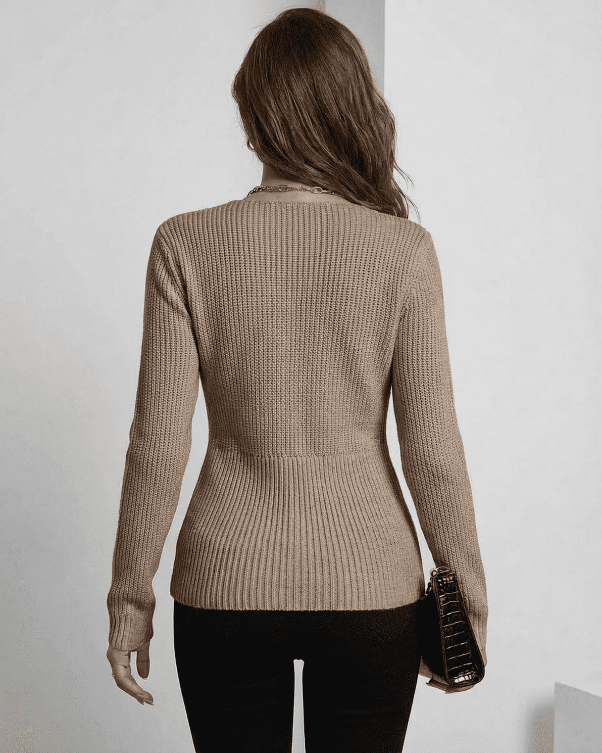 Back view of Seren Pullover by Slimona, showing its elegant ribbed design and fitted silhouette in taupe.