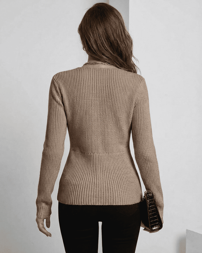 Back view of Seren Pullover by Slimona, showing its elegant ribbed design and fitted silhouette in taupe.