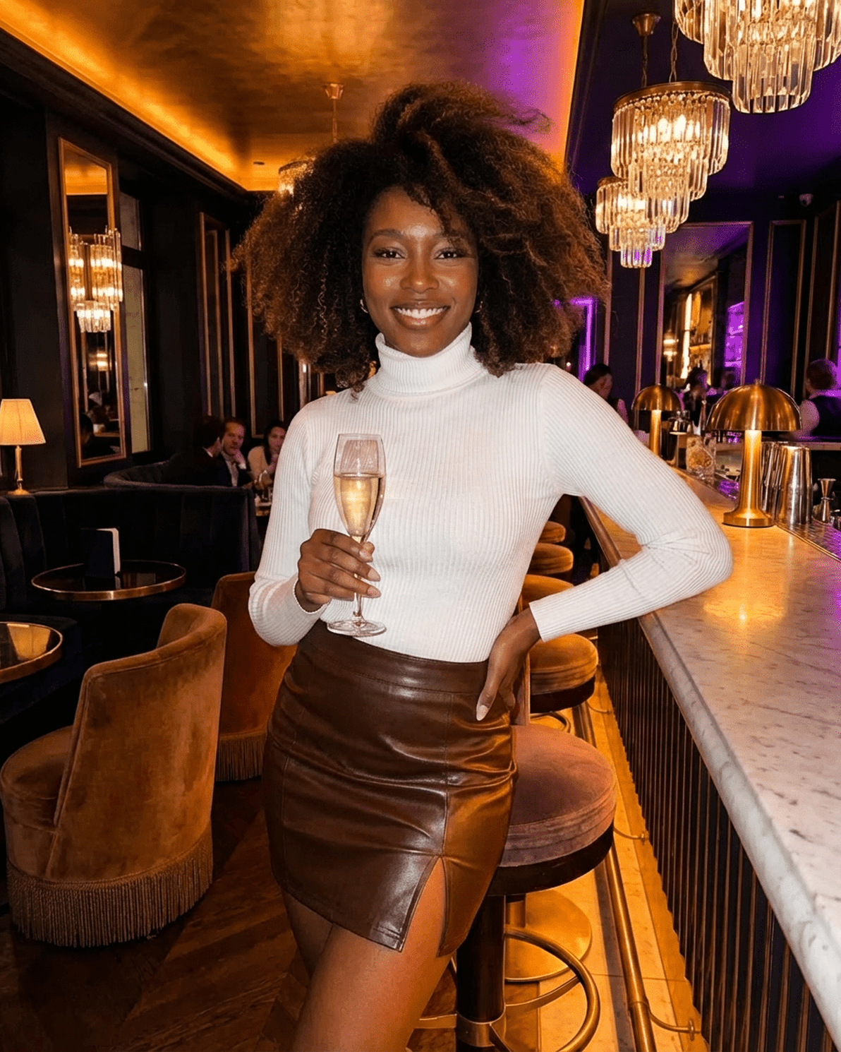 Umbria Mini Skirt by Slimona showcased by a model in a stylish setting, featuring a high-waisted PU A-Line design.