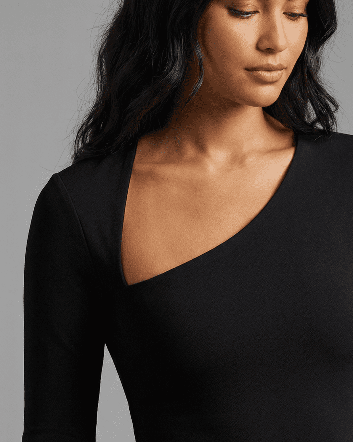 Vega Midi Dress by Slimona, showcasing a stylish one-shoulder design and smooth knit fabric for a flattering fit.