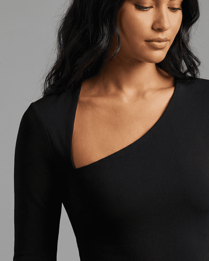 Vega Midi Dress by Slimona, showcasing a stylish one-shoulder design and smooth knit fabric for a flattering fit.