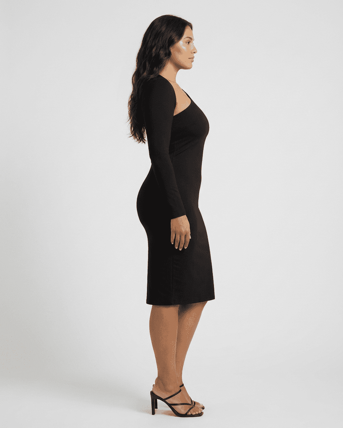 Vega Midi Dress by Slimona displayed on a model from the side showcasing its chic one-shoulder design and bodycon fit.