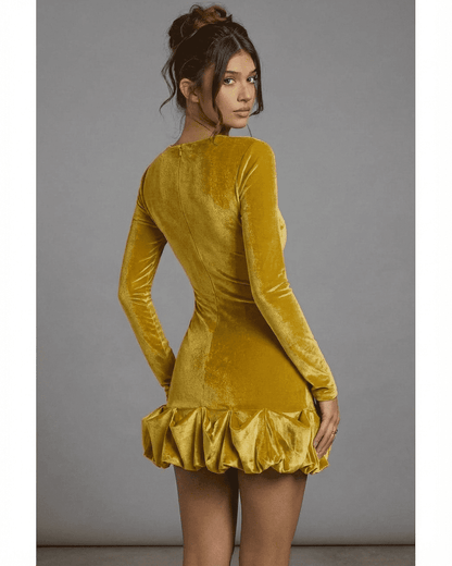 Back view of Velora Mini Yellow by Slimona, featuring a luxe velvet texture and pleated hem detail.