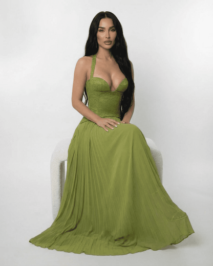 Model showcasing the Verdant Maxi Dress by Slimona, featuring a lace bodice and pleated skirt in olive green.