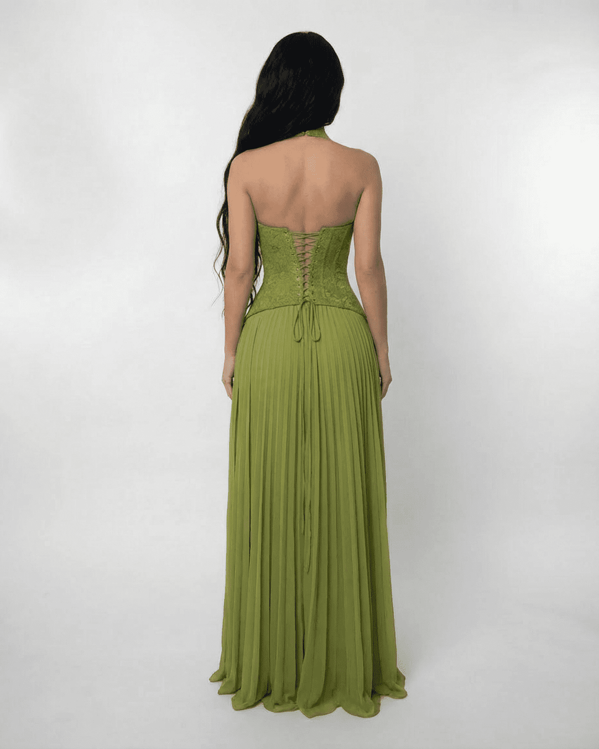 Back view of the Slimona Verdant Maxi Dress featuring a lace bodice and a pleated flowing skirt in olive green.
