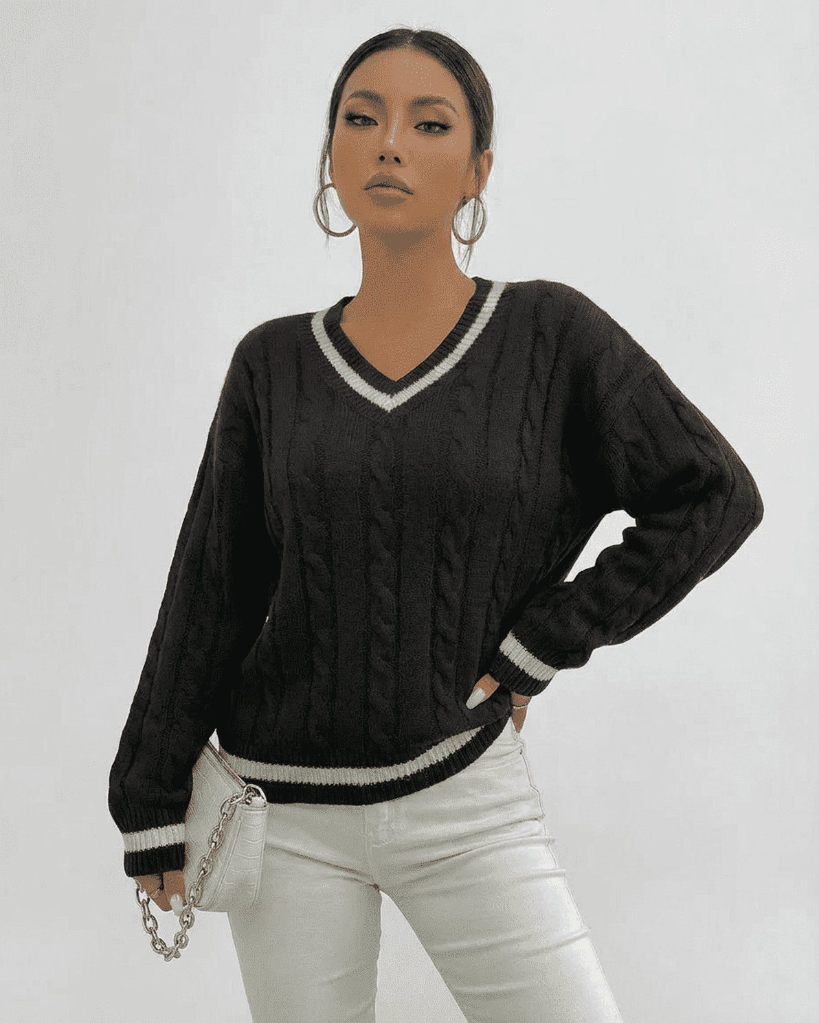 Verona Sweater by Slimona, a black cable knit V-neck pullover, styled for modern versatility and everyday wear.