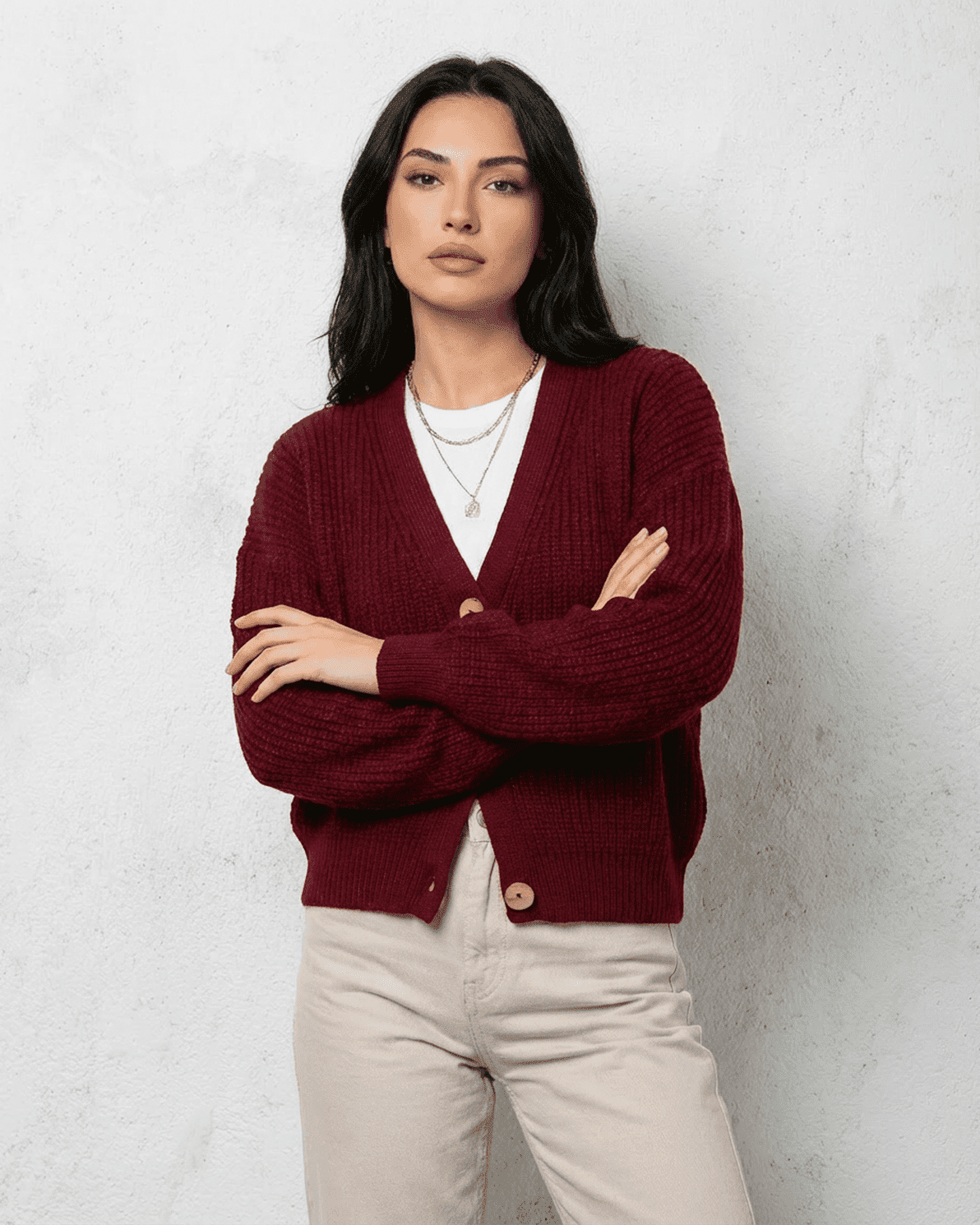 Vesper Cardigan by Slimona in burgundy, featuring a classic V-neck design on a modern woman.