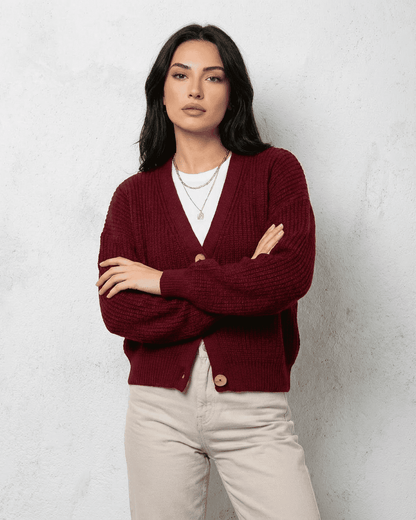 Vesper Cardigan by Slimona in burgundy, featuring a classic V-neck design on a modern woman.