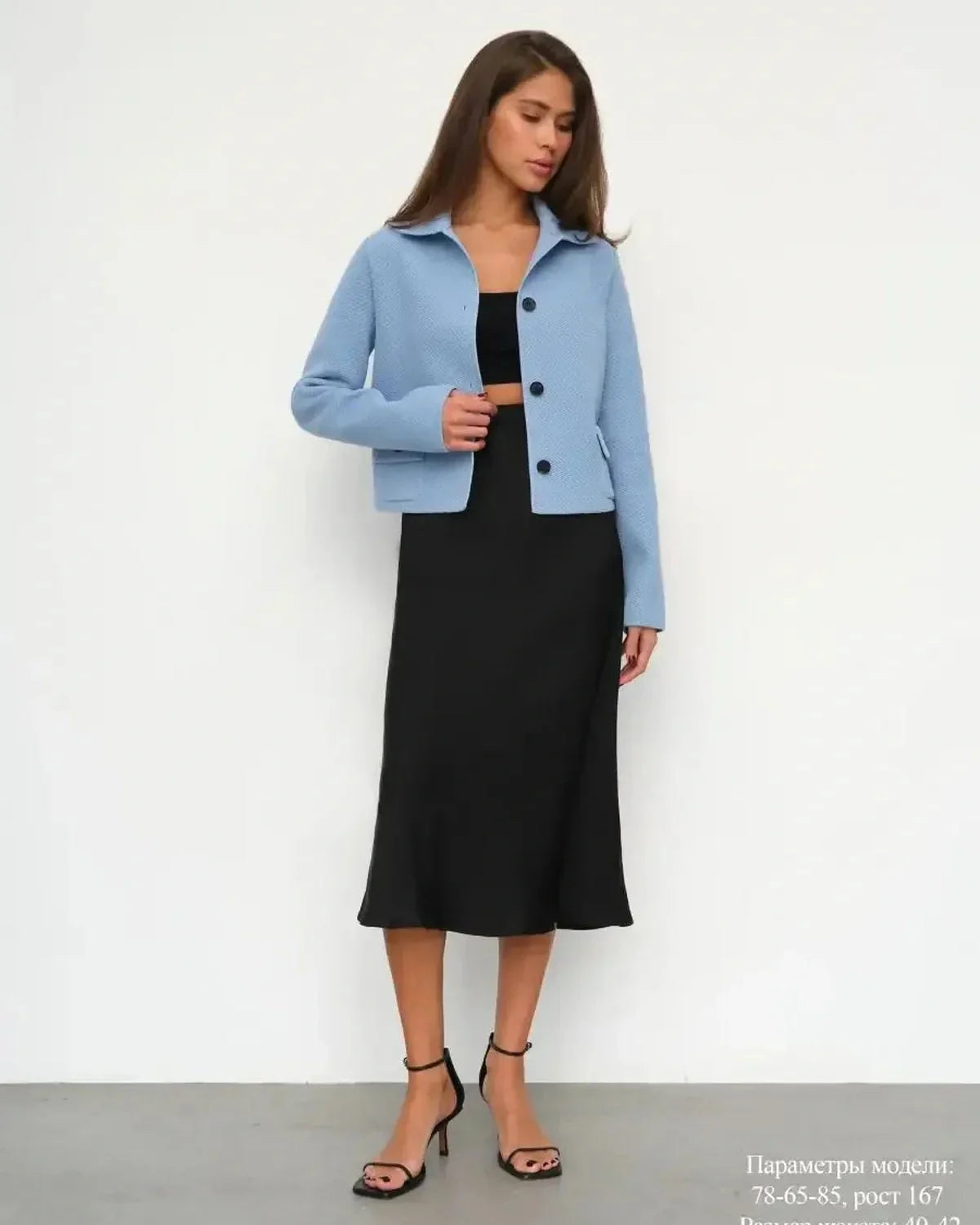 Lazio Jacket by Slimona - Cropped light blue women's jacket with button closure, styled with a black dress.