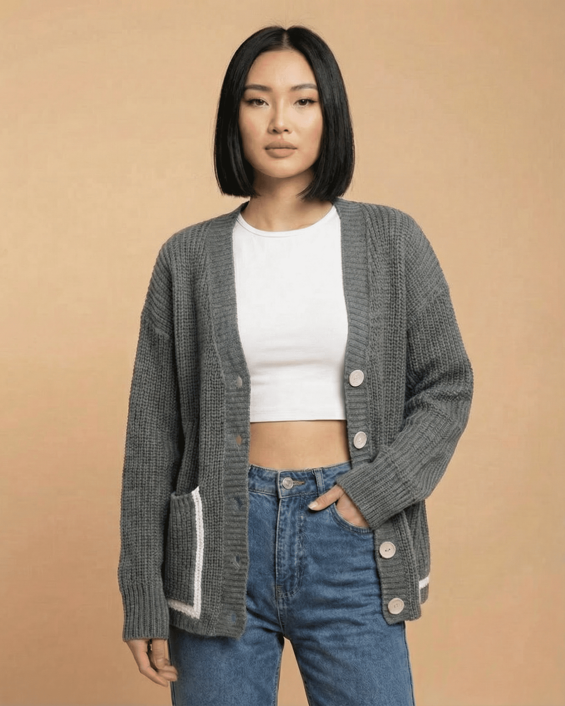 Linden Cardigan by Slimona, relaxed V-neck, color block knit, loose fit silhouette, and button-front closure.