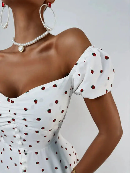 Close-up of Luxe Charm Mini Dress featuring a sweetheart neckline and puff sleeves with red dot pattern.