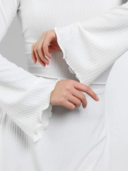 Detail of flared long sleeves on a Luxe Lace-Up white mini dress for women.