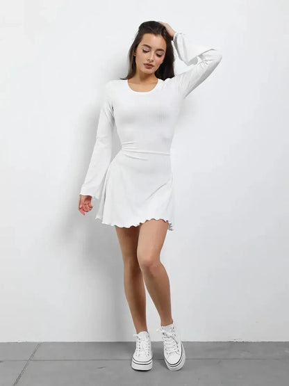 Luxe Lace-Up white mini dress with long sleeves and a flared skirt, perfect for summer and wedding guest occasions.