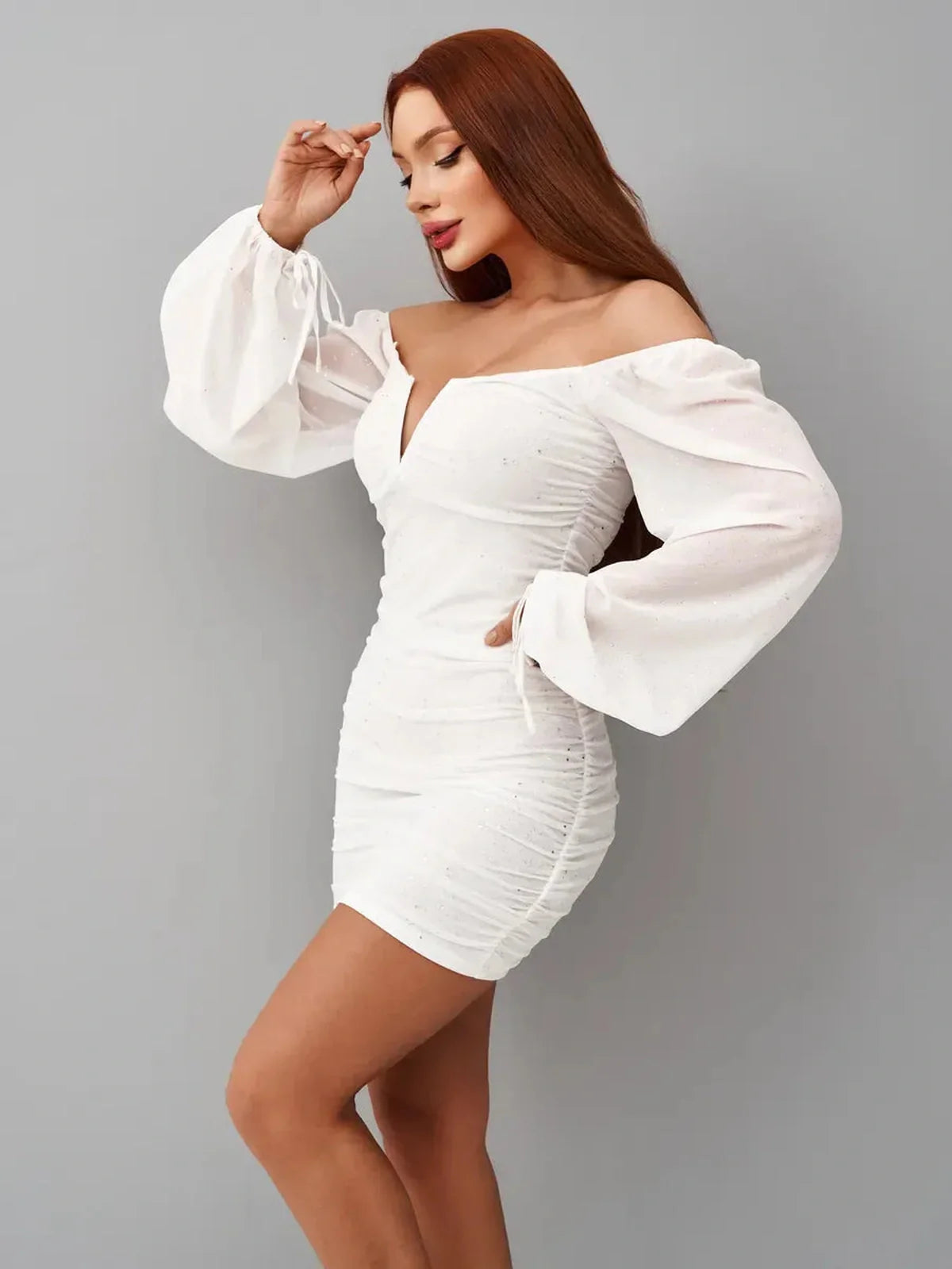 Luxe Spark white mini dress with off-the-shoulder neckline and ruched bodice, perfect for weddings and parties.