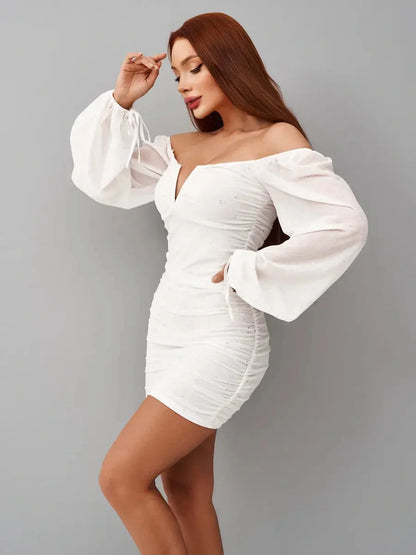 Luxe Spark white mini dress with off-the-shoulder neckline and ruched bodice, perfect for weddings and parties.