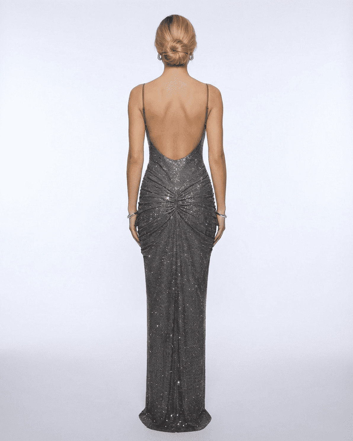 Back view of Lyra Maxi Dress by Slimona, showcasing its elegant sleek design and sparkling crystal embellishments.