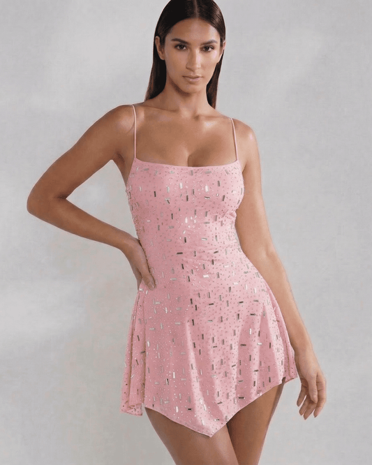 Lyra Mini Dress by Slimona featuring a square neckline, open back, and subtle sparkle in soft blush.