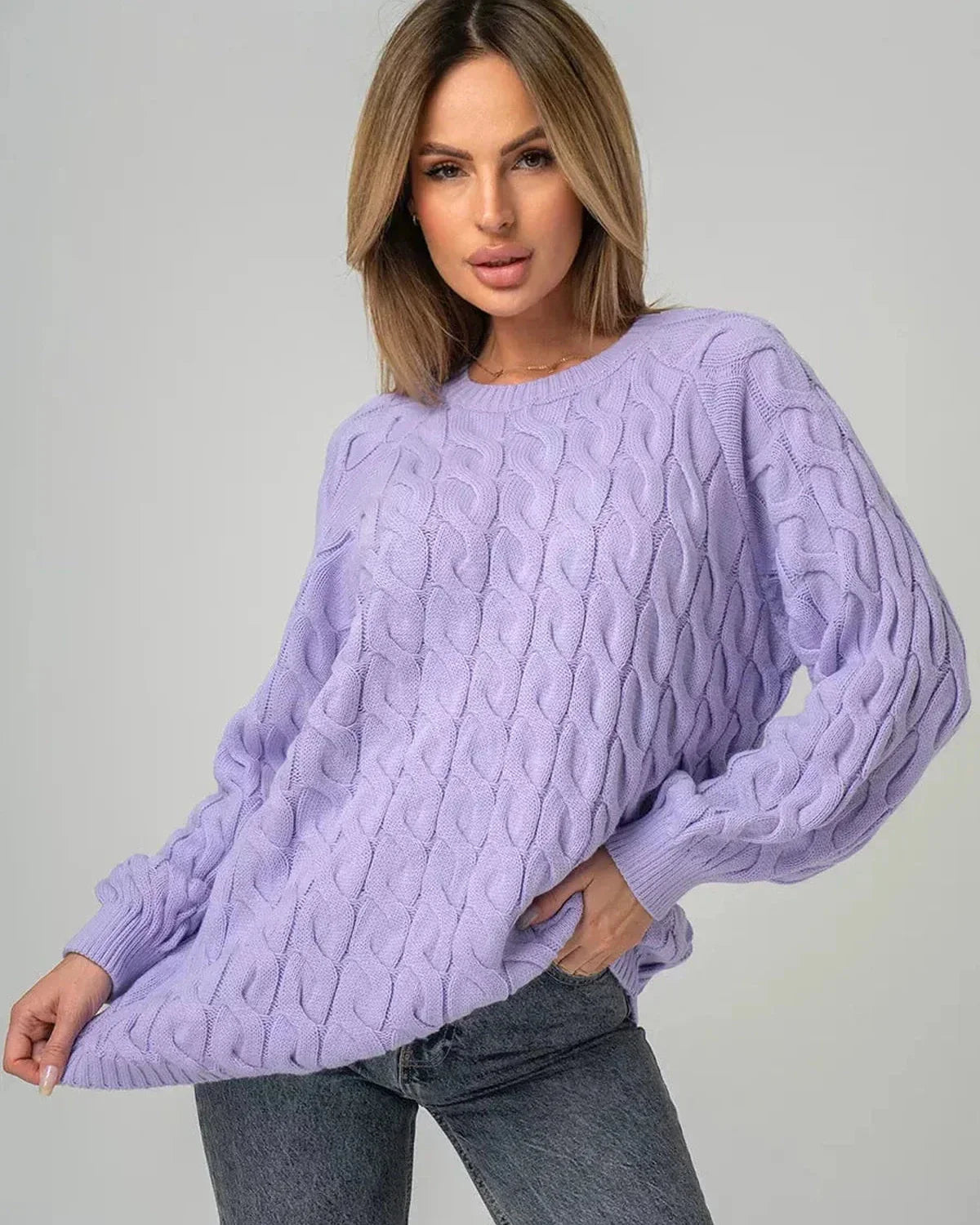 Lyra Sweater by Slimona in oversized lavender knit with modern cable design, offering chic comfort and style.