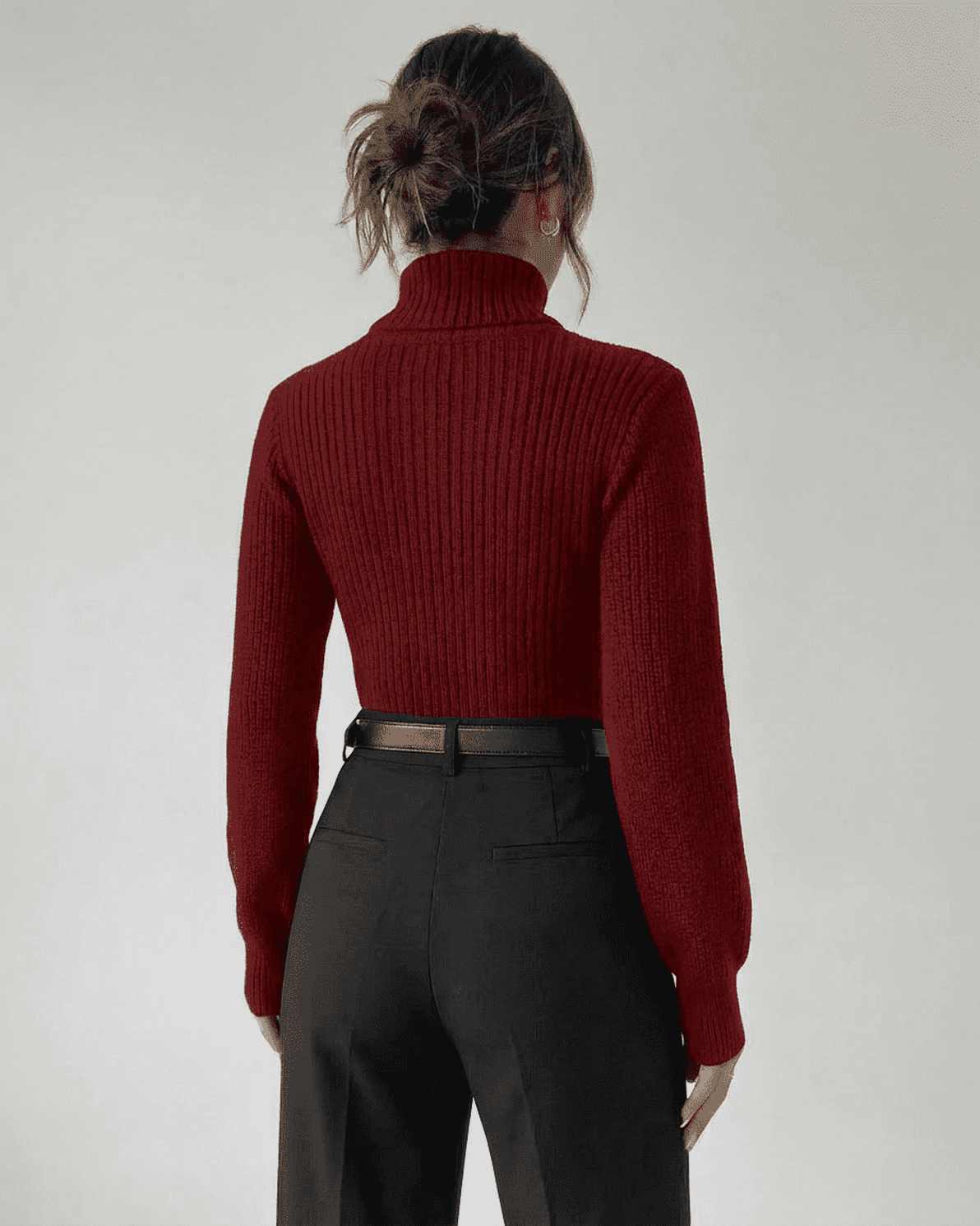 Back view of a woman wearing a Slimona Merlot Sweater with a mock neck and ribbed knit design.