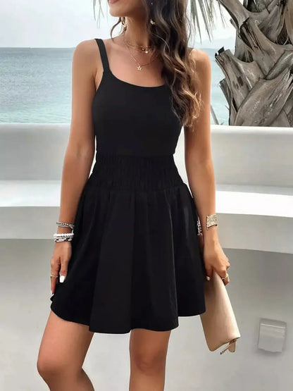 Model wearing a black midi dress with a ribbed bodice and flared skirt, perfect for summer and casual events.