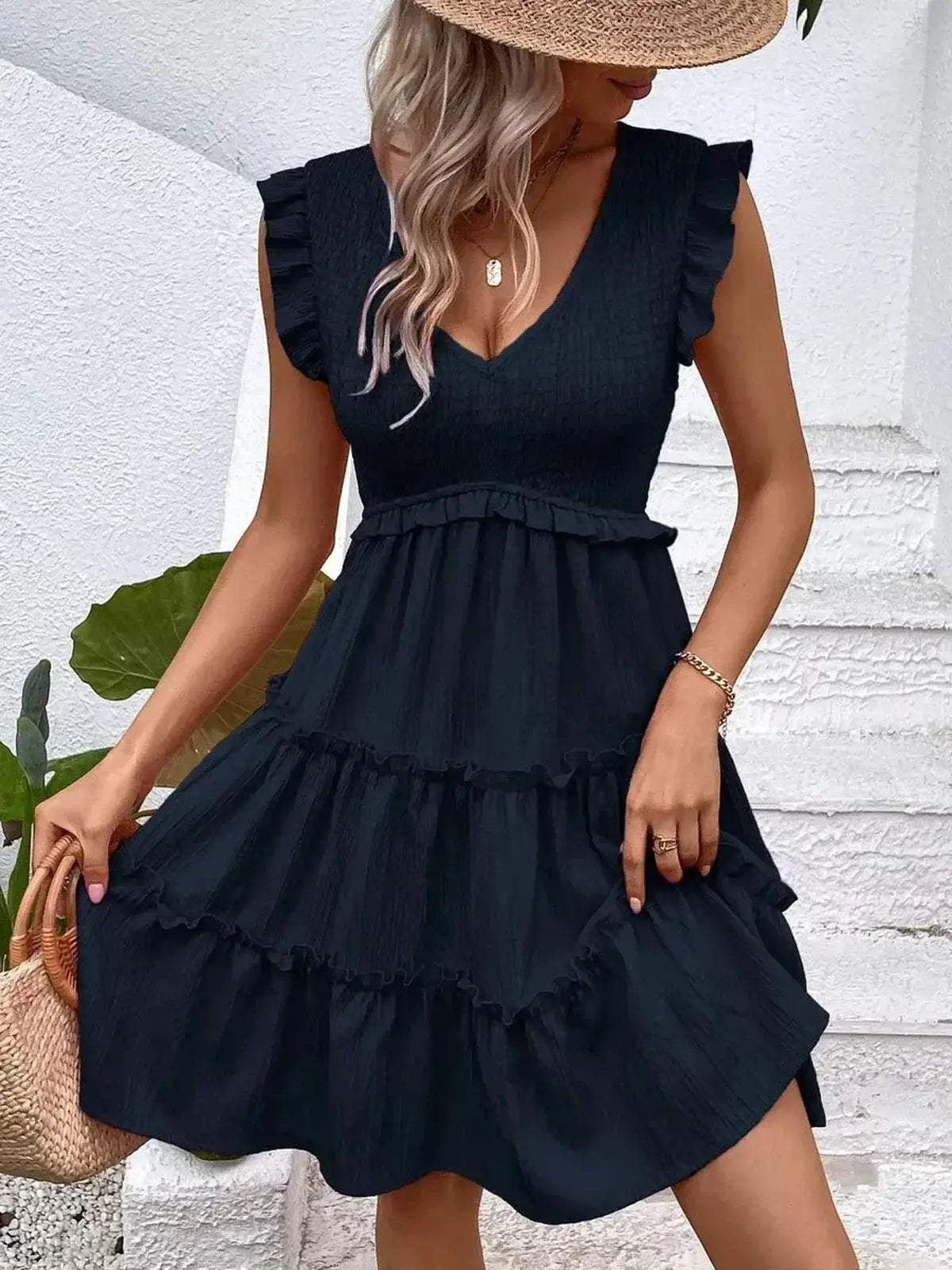 Midnight Frill Mini Dress featuring a deep V-neckline and ruffle sleeves, perfect for summer weddings and parties.