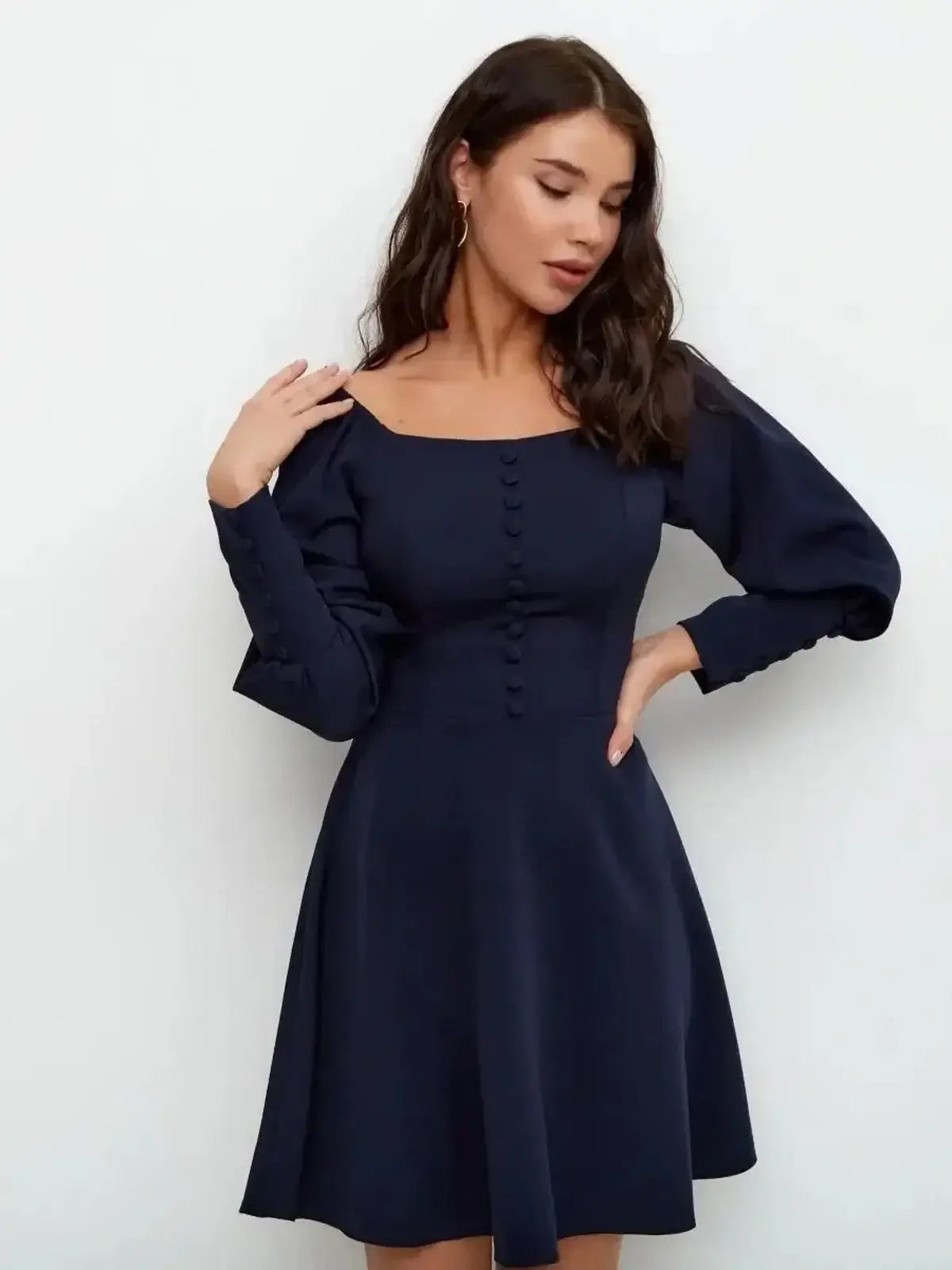 Navy blue Midnight Grace Mini Dress with square neckline and sculptural long sleeves, perfect for formal occasions.