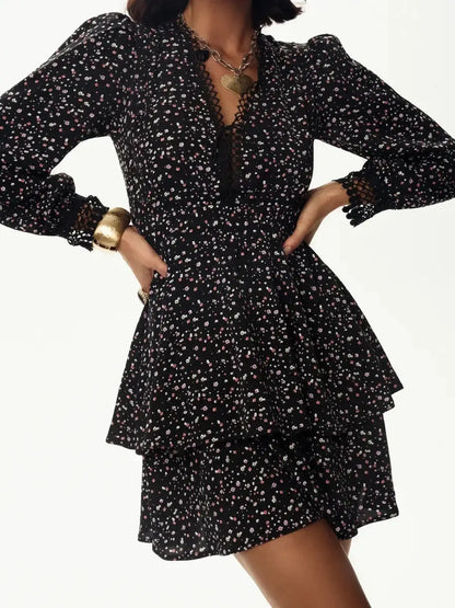 Black mini dress with floral pattern, deep V-neckline, and long sleeves, perfect for summer parties or evening events.