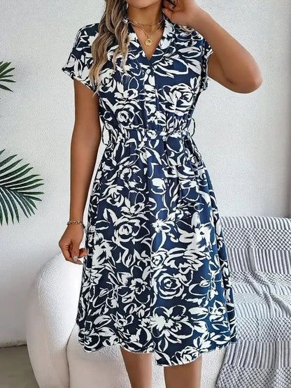 Midnight Petals floral midi dress in navy and white, featuring a flattering V-neckline and cinched waist for summer elegance.