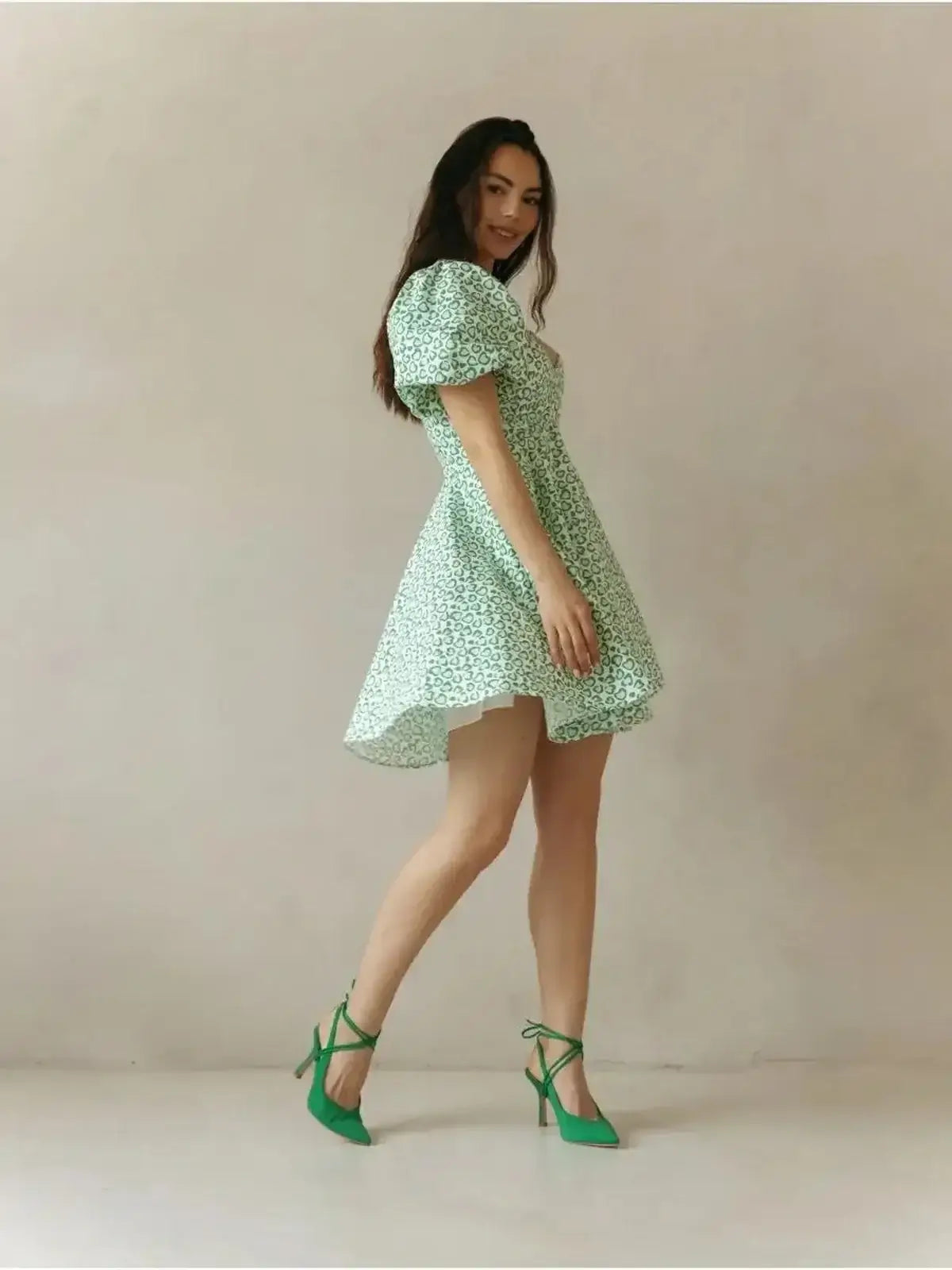 Mint Muse Mini Dress in playful green floral print, showcasing puff sleeves and flirty silhouette.