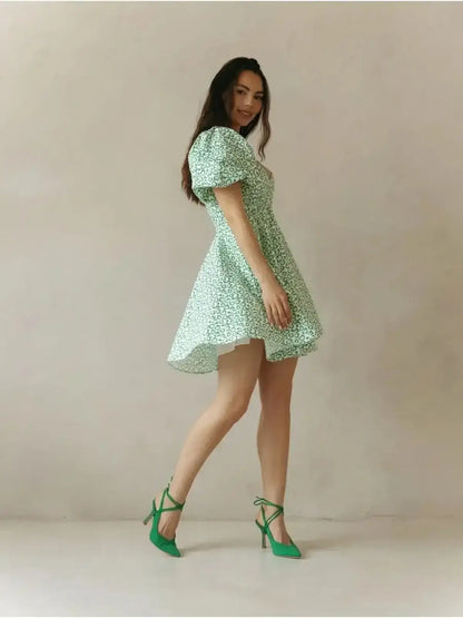 Mint Muse Mini Dress in playful green floral print, showcasing puff sleeves and flirty silhouette.