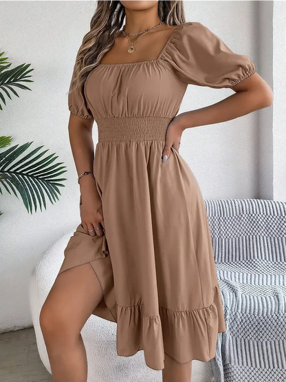 Mocha Breeze mini dress with puff sleeves and a shirred waist, perfect for summer events and casual outings.