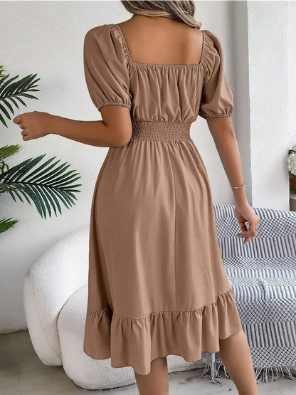Mocha Breeze mini dress with puff sleeves, square neckline, and ruffled hem, perfect for summer events and wedding guests.