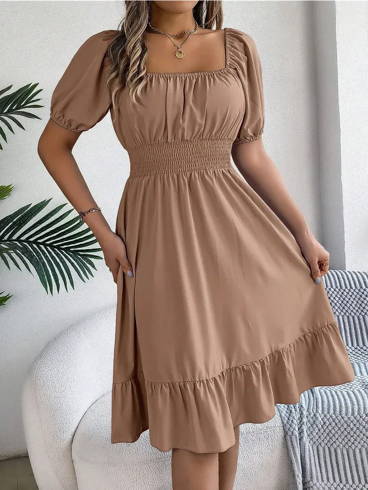 Mocha Breeze mini dress with puff sleeves, square neckline, and ruffled hem, perfect for summer occasions and casual outings.