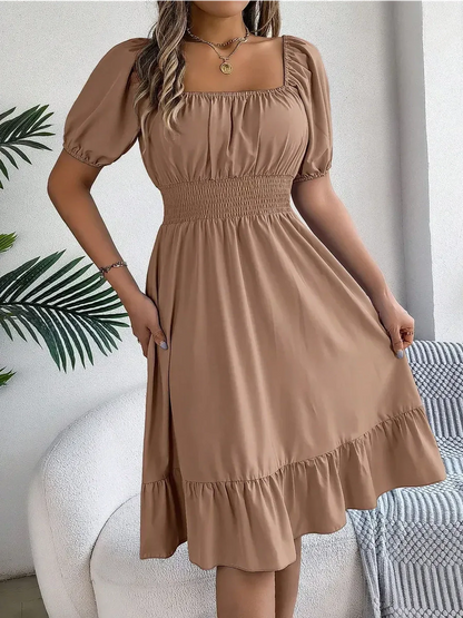 Mocha Breeze mini dress with puff sleeves, square neckline, and ruffled hem, perfect for summer occasions and casual outings.