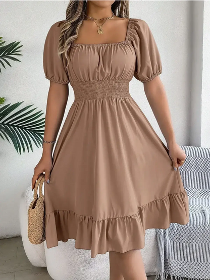 Mocha Breeze mini dress featuring a square neckline, puff sleeves, and a ruffled hem, perfect for summer events.
