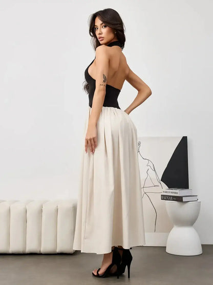 Muse Hourglass black and beige midi dress features a halter-style bodice and flowy skirt, perfect for formal and summer occasions.