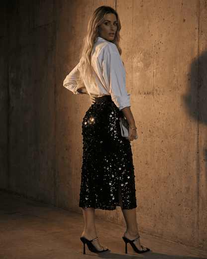 Model wearing Noctura Midi Skirt by Slimona, showcasing a high waist bodycon design with sequins.